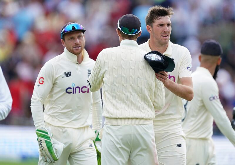 England's Craig Overton, right, celebrates with teammates after the last wicket of India's Mohammad Siraj in Leeds. AP