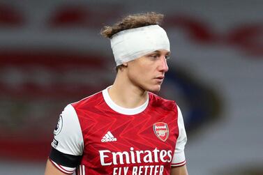 Arsenal's David Luiz played on with a bandaged head against Wolves. Reuters