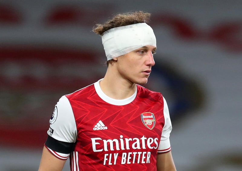 FILE PHOTO: Soccer Football - Premier League - Arsenal v Wolverhampton Wanderers - Emirates Stadium, London, Britain - November 29, 2020 Arsenal's David Luiz  is seen with a bandage on his head. Pool via REUTERS/Catherine Ivill EDITORIAL USE ONLY. No use with unauthorized audio, video, data, fixture lists, club/league logos or 'live' services. Online in-match use limited to 75 images, no video emulation. No use in betting, games or single club /league/player publications.  Please contact your account representative for further details./File Photo