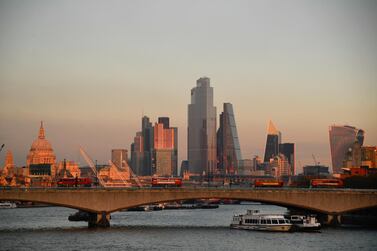 St. Paul's Cathedral and buildings of the City of London financial district are seen as buses cross Waterloo bridge at sunset. The record-breaking rise in growth in the third quarter follows a recording breaking fall in GDP of 19.8 per cent in the previous three months. Reuters