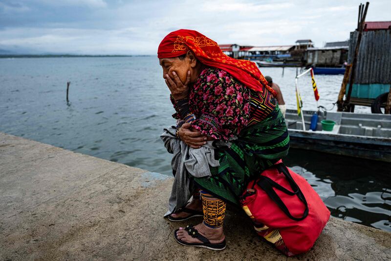 An Indigenous Guna woman waits for her transfer from Carti Sugtupu island to the mainland, in Guna Yala Comarca, on the Caribbean coast in Panama. AFP