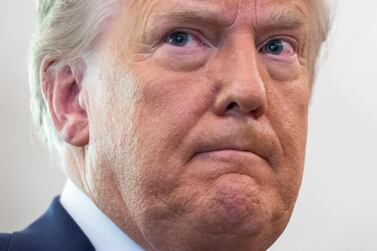 US President Donald Trump looks on during a ceremony at the White House in Washington, DC, December 7, 2020.  AFP 