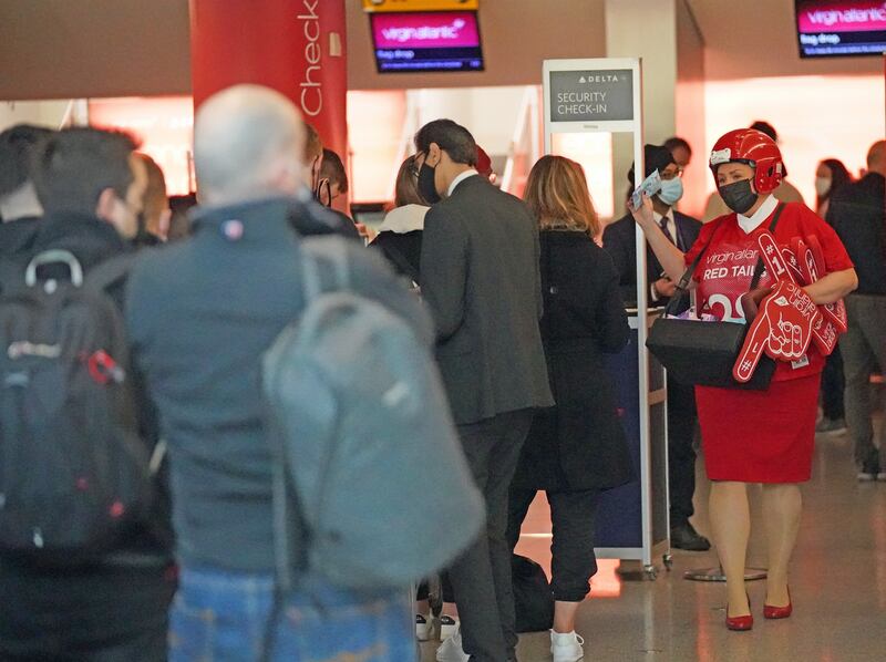 Passengers queue at Heathrow as the US reopens its borders to visitors from Britain