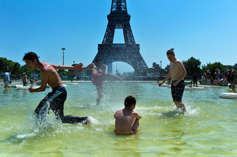 The Trocadero Gardens fountains offered some respite from extreme temperatures in Paris, France, last month as a mass of hot air moved north from Africa to Europe, pushing up the mercury. Thibault Camus / AP Photo