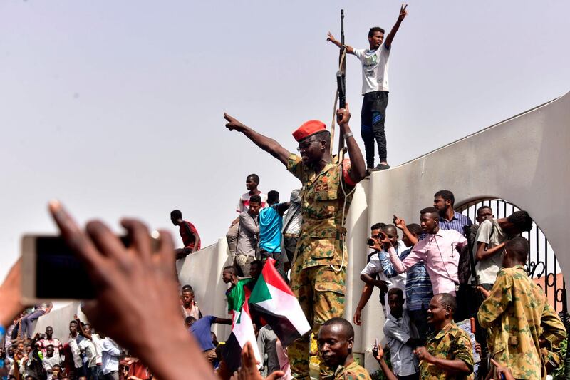 Members of the Sudanese military gather in a street in central Khartoum on April 11, 2019, after one of Africa's longest-serving presidents was toppled by the army. AFP