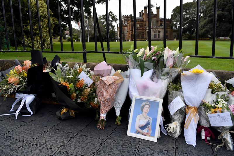 Messages of condolences and floral tributes are left at the gates of Government House in Sydney, Australia. EPA