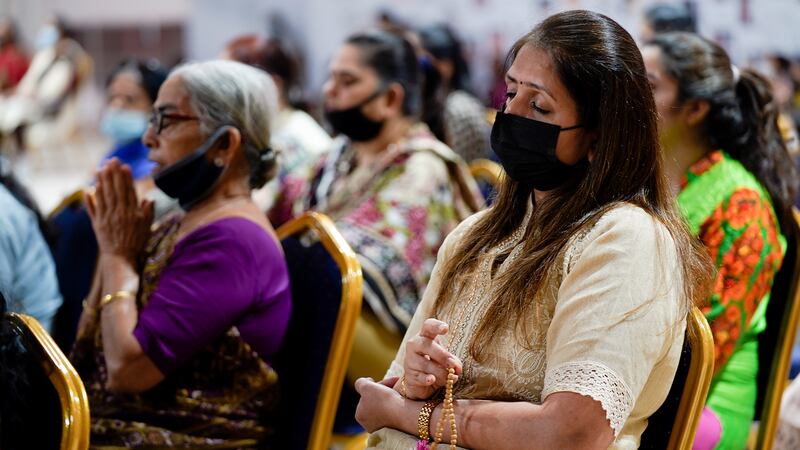 Devotees pay homage to Sheikh Khalifa and his legacy of peace and harmony at the Baps Hindu temple in Abu Dhabi. 