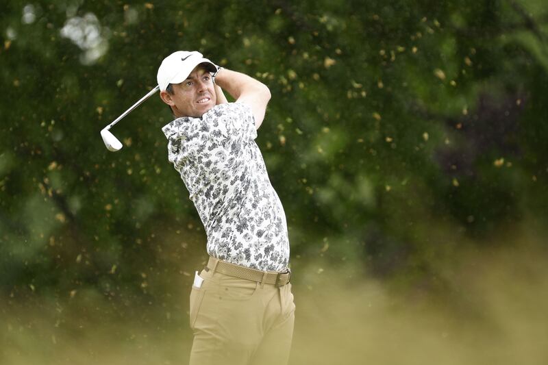 Rory McIlroy plays his shot from the sixth tee at The Country Club. AFP