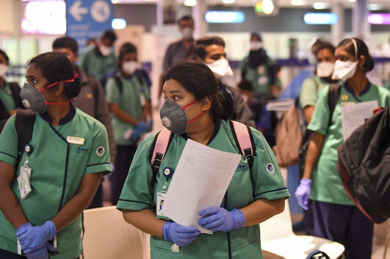 Members of an Indian medical team arrive at Dubai International Airport to help with the coronavirus (COVID-19) pandemic.   AFP