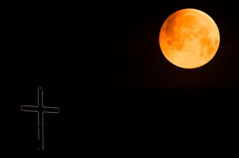 The Super Flower Blood Moon shines in the sky over Millennium Cross near Skopje. EPA