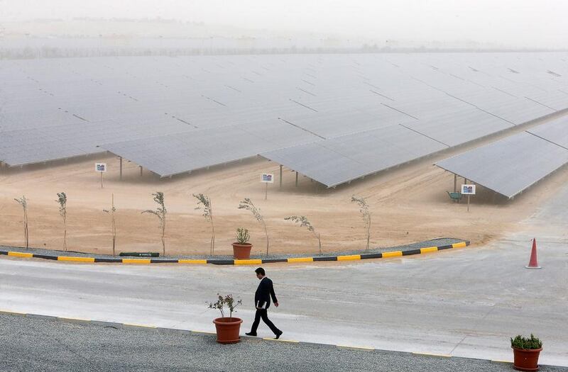 Above, the 200-megawatt second phase of the Mohammed bin Rashid Al Maktoum solar park, which has enough capacity to power 50,000 homes in Dubai. Pawan Singh / The National