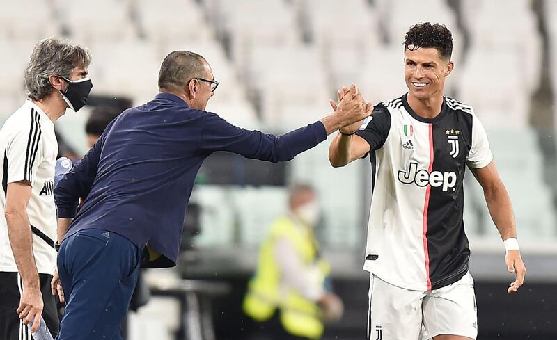 Cristiano Ronaldo celebrates  with his coach Maurizio Sarri after scoring. EPA