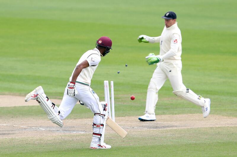 West Indies' Roston Chase, left, is run out by England's Dom Bess during day five of the Third Test at Emirates Old Trafford. PA