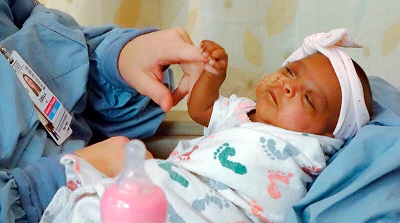 This April, 2019 photo provided by Sharp HealthCare in San Diego shows a baby named Saybie. Sharp Mary Birch Hospital for Women & Newborns said in a statement Wednesday, May 29, 2019, that Saybie, born at 23 weeks and three days, is believed to be the world's tiniest surviving baby, who weighed just 245 grams (about 8.6 ounces) before she was discharged as a healthy infant. She was sent home this month weighing 5 pounds (2 kilograms) after nearly five months in the hospital's neonatal intensive care unit. (Sharp HealthCare via AP)