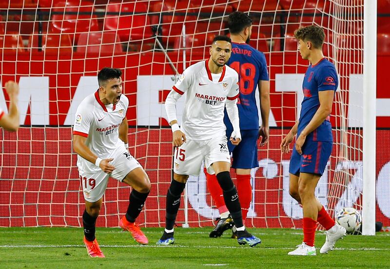 Sevilla's Marcos Acuna celebrates scoring against Atletico Madrid. Reuters