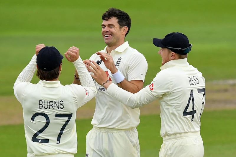England's James Anderson (C) celebrates with teammates after taking the wicket of Pakistan's Babar Azam for 69 in the opening over on the second day of the first Test cricket match between England and Pakistan at Old Trafford in Manchester, north-west England on August 6, 2020.   - RESTRICTED TO EDITORIAL USE. NO ASSOCIATION WITH DIRECT COMPETITOR OF SPONSOR, PARTNER, OR SUPPLIER OF THE ECB
 / AFP / POOL / Dan MULLAN / RESTRICTED TO EDITORIAL USE. NO ASSOCIATION WITH DIRECT COMPETITOR OF SPONSOR, PARTNER, OR SUPPLIER OF THE ECB
