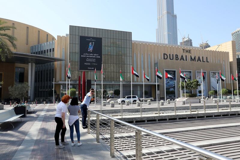 Dubai, United Arab Emirates - Reporter: N/A: Standalone. A visitor looks excited to have his picture taken outside Dubai Mall. Saturday, February 8th, 2020. Downtown, Dubai. Chris Whiteoak / The National