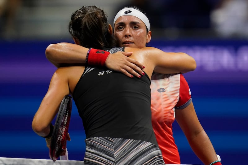 Ons Jabeur hugs Caroline Garcia after the match in New York. AP
