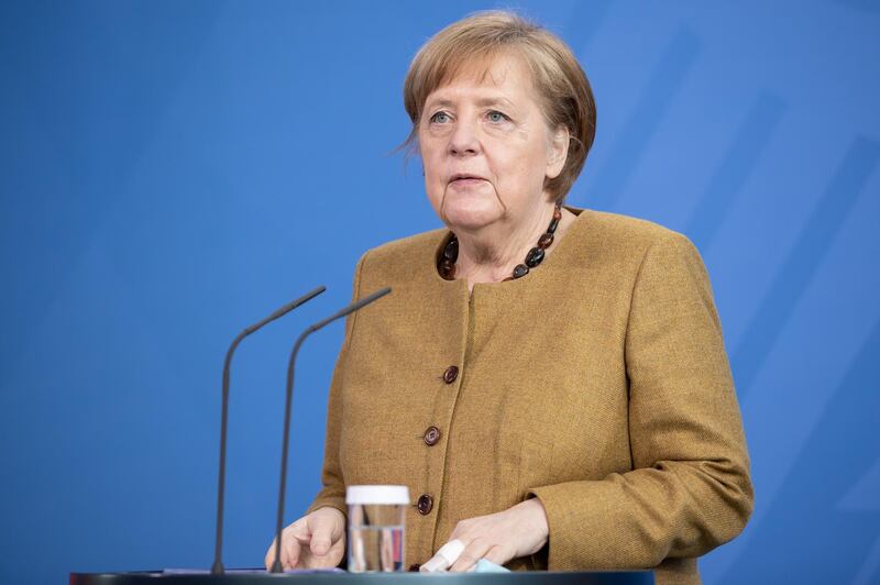 epa09132432 German Chancellor Angela Merkel gives a statement after a cabinet meeting in Berlin, 13 April 2021. The German cabinet in its 137th session agreed on a change of the German Infection Protection law amid the coronavirus pandemic that would allow the implementation of countrywide counter-measures in case of a certain rate of infections. Both chambers of the German parliament still have to approve the amendment.  EPA/ANDREAS GORA / POOL