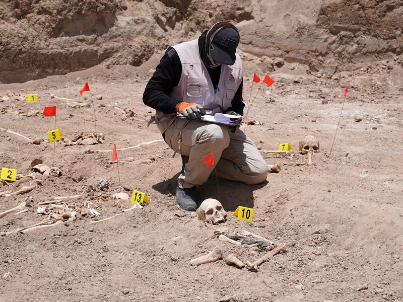 A forensic expert working for the Iraqi authorities at a mass grave near Najaf.