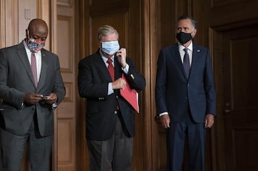 Republican senators, from left, Tim Scott, Lindsey Graham and Mitt Romney. Republicans are divided over the size and scope of additional federal spending. Bloomberg