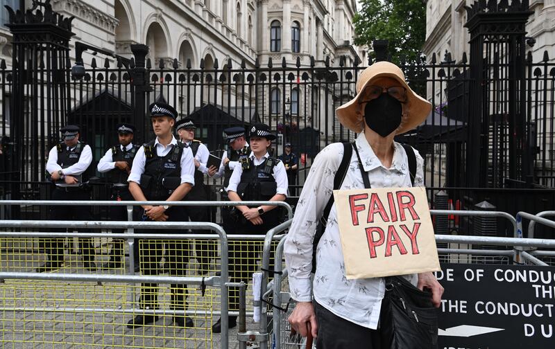 A protester demonstrates outside Downing Street. EPA