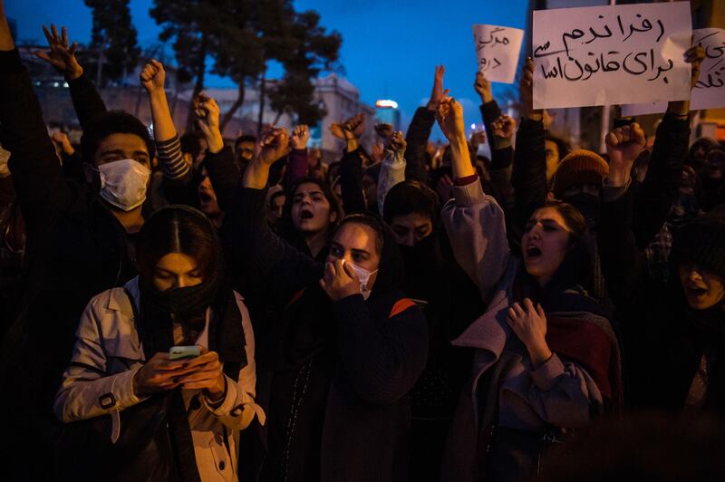 Demonstrators chant while gathering during a vigil for the victims of the Ukraine International Airlines flight that was shot down by Iran, in Tehran, Iran. Bloomberg