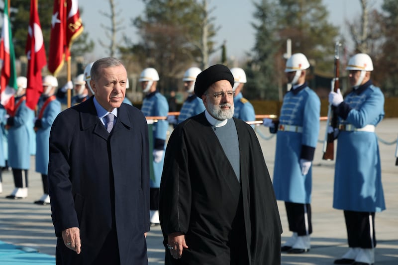 Turkish President Recep Tayyip Erdogan and his Iranian counterpart Ebrahim Raisi review a guard of honour during a welcome ceremony in Ankara. Reuters