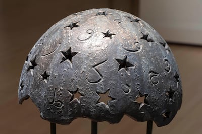 An iron shell with Arabic letters engraved by Cristobal Martin. Courtesy Casa Arabe