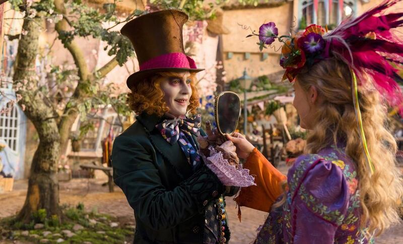 Johnny Depp, left, and Mia Wasikowska in Alice Through the Looking Glass. Emma Stone lost out on the role of Alice. Photo: Disney via AP