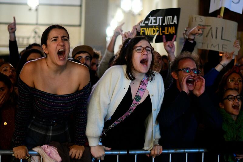 Protestors shout slogans outside Malta's prime minister's office. AP Photo