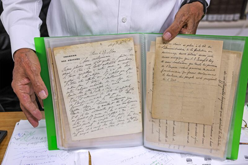 Khader holds a letter also written by Al Khalidi