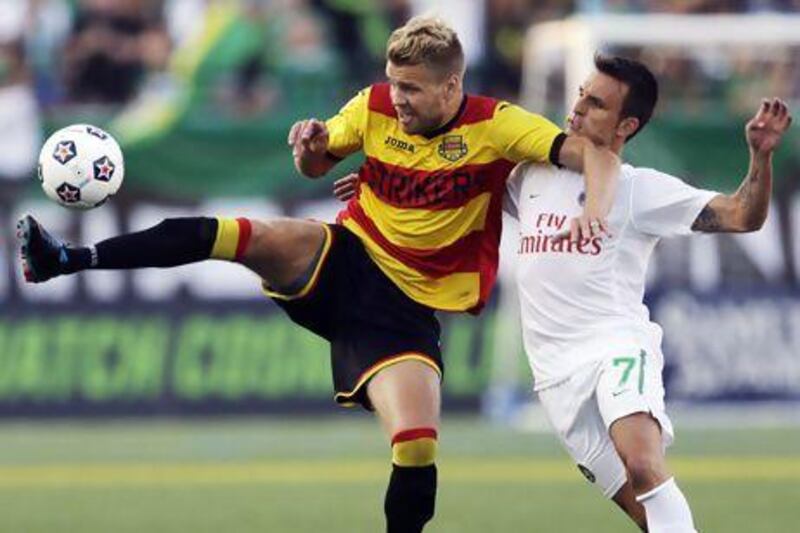 Fort Lauderdale Strikers' Toni Stahl, left, and New York Cosmos' Ayoze Garcia fight for the ball. Frank Franklin II / AP Photo