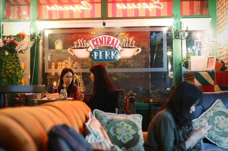 This photo taken on April 23, 2018 shows customers talking at the "Central Perk" coffee shop in Shanghai.
Millions of Chinese "Friends" fans are heartbroken after a video site pulled the US sitcom, beloved by millennials in China for its endearing young characters and as an English conversation resource. / AFP PHOTO / - / China OUT / TO GO WITH China-US-entertainment-internet-Friends,FOCUS by Albee ZHANG