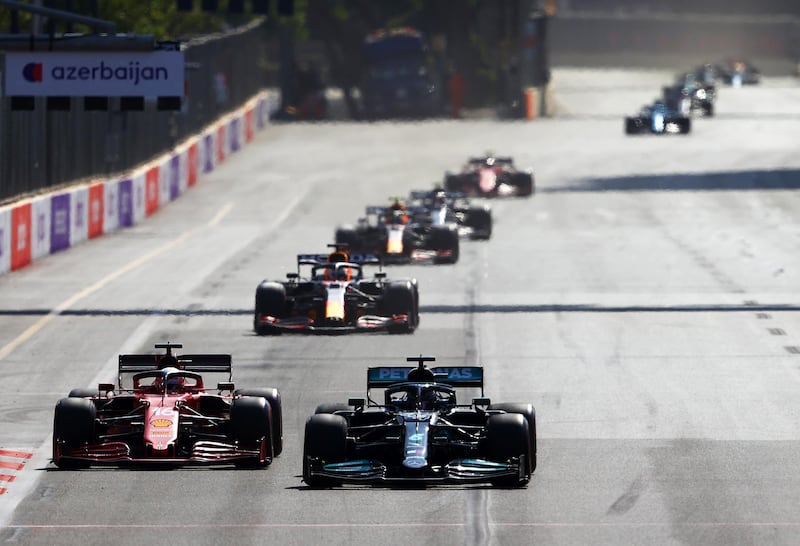 Lewis Hamilton overtakes Charles Leclerc's Ferrari at the start of the GP. Getty