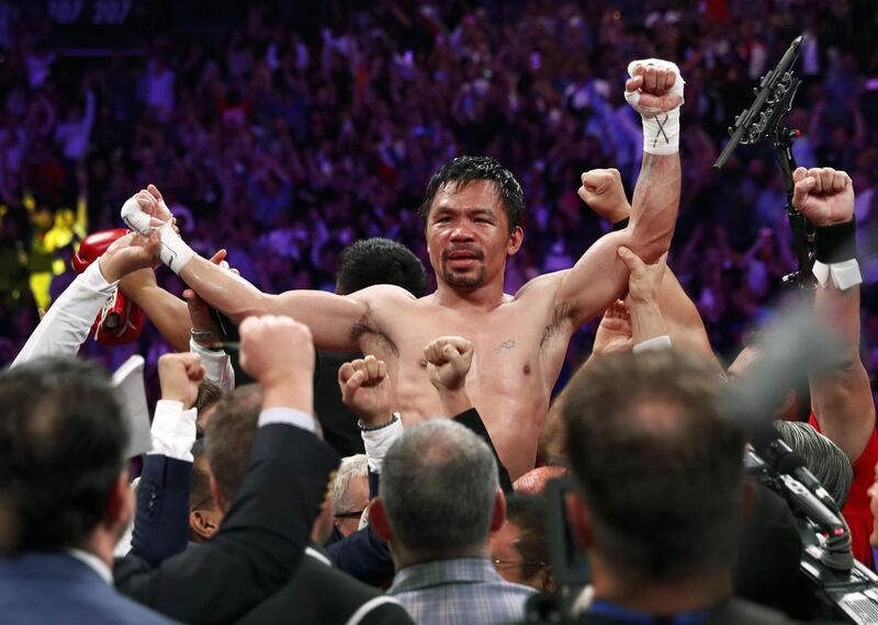 Manny Pacquiao celebrates his split decision victory over Keith Thurman in their WBA welterweight title fight at MGM Grand Garden Arena, AFP
