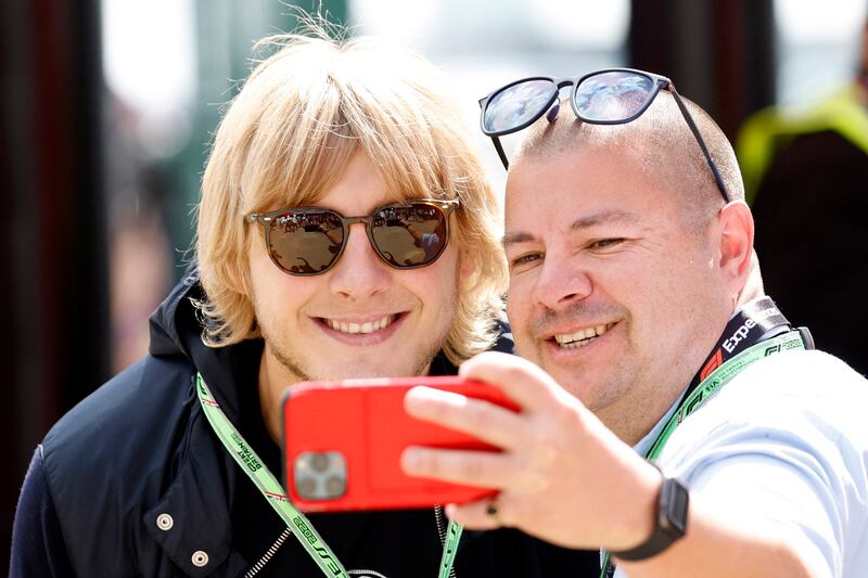 UFC fighter Paddy Pimblett poses with a fan. Reuters