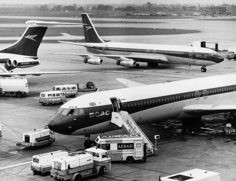 A BOAC Boeing 707 taxing to its' terminal gate as two Vickers VC10 long-range narrow-body four engined commercial jet airliners for the British Overseas Airways Corporation are refuelled at London Heathrow airport on 22 October 1968 in London, United Kingdom (Photo by Tim Graham/Fox Photos/Hulton Archive/Getty Images).