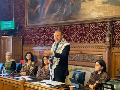 Palestinian ambassador Dr Hussam Zomlot, standing, Baroness Sayeeda Warsi, right, and MP Leila Moran, second left, commemorate the 75th anniversary of the Nakba at the House of Commons in London.  Photo: Caabu