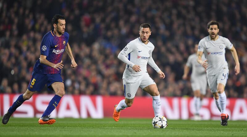 BARCELONA, SPAIN - MARCH 14:  Eden Hazard of Chelsea is chased by Sergio Busquets of Barcelona during the UEFA Champions League Round of 16 Second Leg match FC Barcelona and Chelsea FC at Camp Nou on March 14, 2018 in Barcelona, Spain.  (Photo by David Ramos/Getty Images)