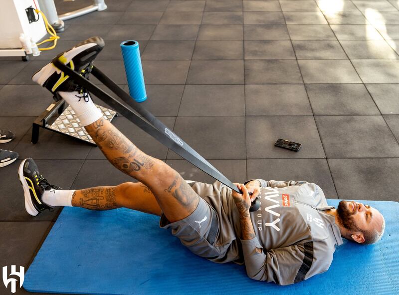 Neymar does some stretching exercises. Reuters