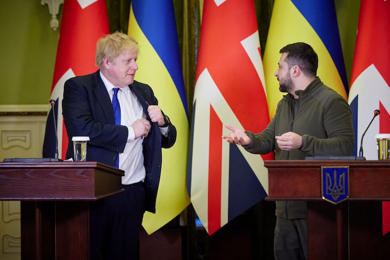 Mr Johnson and Mr Zelenskyy attend a news briefing. Reuters