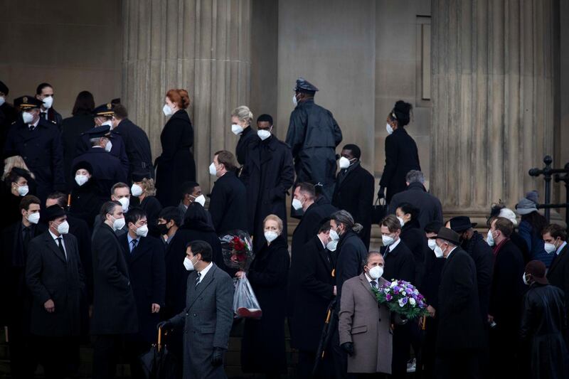 Actors and extras wear masks on set. Getty Images