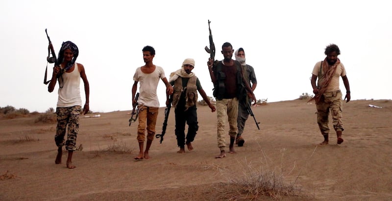 epaselect epa06908532 Soldiers of Yemeni government army backed by the Saudi-led coalition take position during military operations on Houthi positions in the port province of Hodeidah, Yemen, 24 July 2018.  According to reports, Yemeni government forces backed by the Saudi-led coalition claimed control of strategic towns in the Red Sea port-province of Hodeidah after fierce clashes broke out with the Houthi militias.  EPA/NAJEEB ALMAHBOOBI