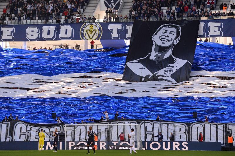 Bordeaux's supporters display a banner depicting late Argentine footballer Emiliano Sala during the French L1 football match between Bordeaux (FCGB) and Toulouse (TFC) at the Matmut Atlantique stadium in Bordeaux, southwestern France, on February 17, 2019. / AFP / NICOLAS TUCAT
