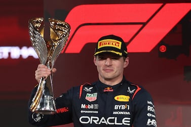 Dutch Formula One driver Max Verstappen of Red Bull Racing celebrates on the podium with his trophy after winning the Formula 1 Abu Dhabi Grand Prix in Abu Dhabi, United Arab Emirates, 26 November 2023.   EPA / ALI HAIDER
