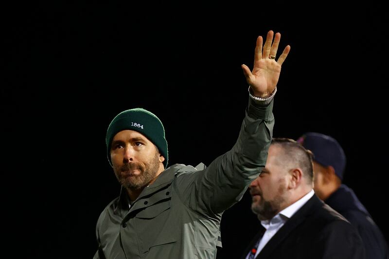 WREXHAM, WALES - JANUARY 29: Ryan Reynolds, Co-Owner of Wrexham acknowledges the fans after the draw during the Emirates FA Cup Fourth Round match between Wrexham and Sheffield United at Racecourse Ground on January 29, 2023 in Wrexham, Wales. (Photo by Michael Steele / Getty Images)