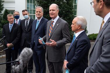 Southwest Airlines chairman and chief executve Gary Kelly, centre, alongside other airline bosses speaks to reporters at the White House on Thursday after a meeting with Chief of Staff Mark Meadows in a bid to secure more government support for the industry. AFP