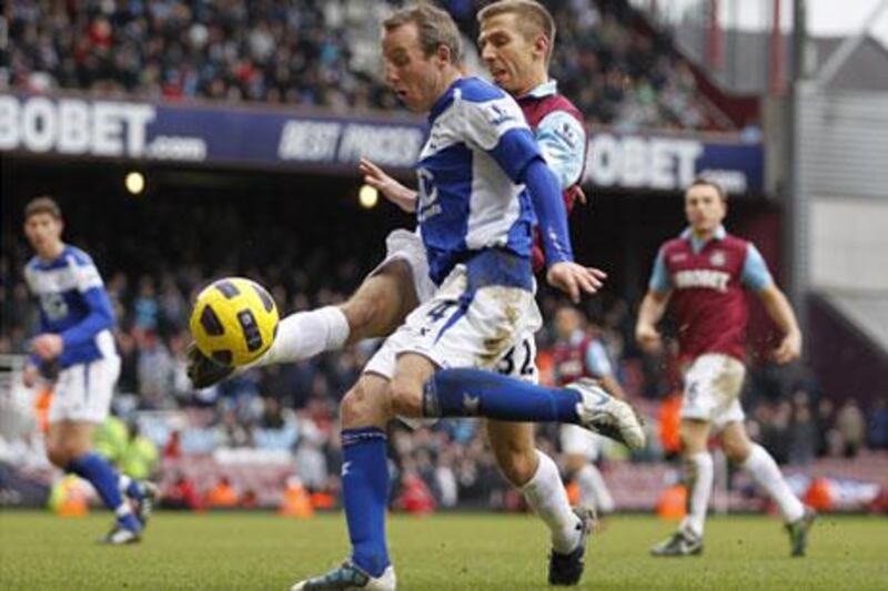 West Ham United's Gary O'Neill, right, tackles Birmingham City's Lee Bowyer.