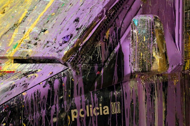A police van stained with paint thrown by demonstrators, is pictured outside the Catalan government's Interior Department during a "Balloons Party" demonstration called by the local Republic Defence Committees (CDR) in Barcelona. AFP